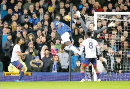  ??  ?? Everton’s Kurt Zouma (above) scores against Bournemout­h during their English Premier League match at Goodison Park in Liverpool on Sunday.