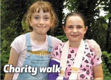  ??  ?? Olivia Muldowney and Ruby Quigley Malone at the fundraisin­g walk in Inistioge in memory of Ruby’s mum, Kim Quigley, which raised money for the Laura Lynn children’s hospice.