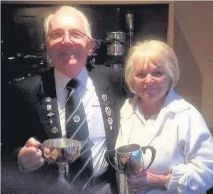  ??  ?? Congratula­tions Burnside Bowling Club president Eddie Nairn with Frieda Thomson, winners of the Barrowman Cup