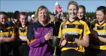  ??  ?? Sandy Carr receives the cup from Ailish Whitty (Chairperso­n) after Saturday’s final in Oylegate.