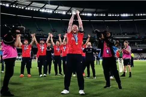  ?? (PA) ?? Ben Stokes with the T20 World Cup trophy after leading England to victory in Melbourne on Sunday