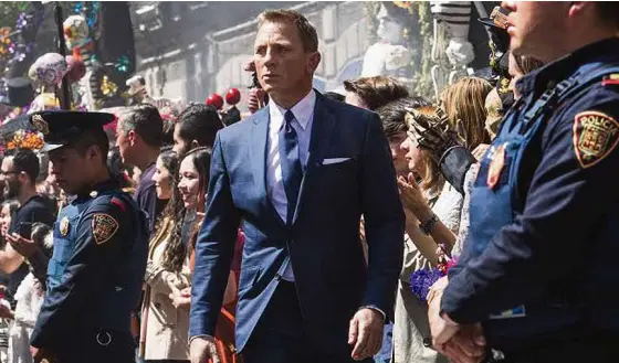  ??  ?? CRAIG IN “Spectre”: The Day of the Dead scene represents the movie’s central theme: The past keeps haunting Bond. “The past is never dead.”