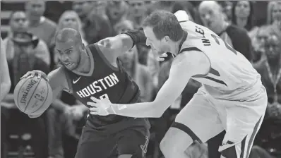  ?? RICK BOWMER / AP ?? Chris Paul of the Houston Rockets drives past Utah Jazz defender Joe Ingles during Thursday’s game in Salt Lake City. Paul had 18 points and 13 rebounds as the Rockets won 112-101.