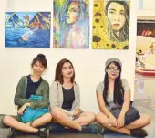  ??  ?? Fine Arts students of University of Rizal System Angono Hazel Ann Mina, Sarah Dino and Sunshine Bantisil in front of their artworks represent a new wave of visual artists in the province.