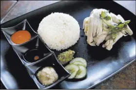  ??  ?? Hainanese Chicken Rice is served with three house-made sauces.