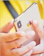  ?? Picture: REUTERS/FILE ?? A customer handles an Apple’s new iPhone XS after it went on sale at the Apple Store in Tokyo’s Omotesando shopping district,
Japan in 2018.