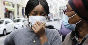  ?? | EPA ?? PARISHIONE­RS near the Notre Dame Basilica church in Nice, France, yesterday, following a knife attack in which three people a died, one of whom was beheaded.