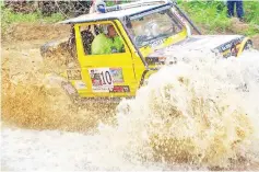  ??  ?? A competitor car going through a watery obstacle in the recent inaugural Borneo Sipitang 4x4 Adventure Land Challenge 2018.