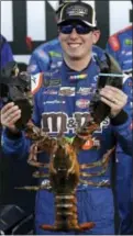  ?? CHARLES KRUPA — THE ASSOCIATED PRESS ?? Kyle Busch smiles and holds up a giant lobster after winning the NASCAR Cup Series 300 auto race at New Hampshire Motor Speedway in Loudon, N.H., Sunday.