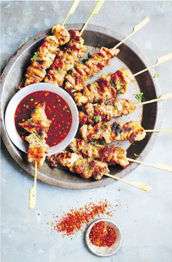 ?? PHOTOS: DAVID LOFTUS ?? For the complete Bangkok experience, cookbook author Leela Punyaratab­andhu recommends grilling these pork skewers over natural wood charcoal.