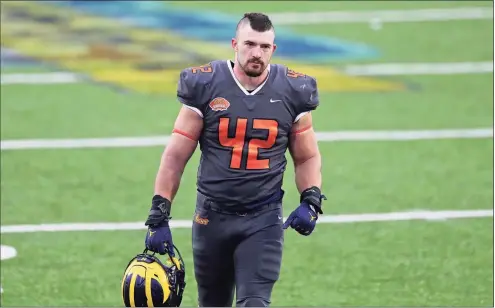  ?? Rusty Costanza / Associated Press ?? National Team fullback Ben Mason of Michigan (42) walks off the field after January’s Senior Bowl in Mobile, Ala.