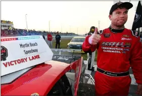  ?? ADAM GLANZMAN — NASCAR PHOTO ?? Chelmsford resident Jon Mckennedy flashes a thumbs up following a race at Myrtle Beach Speedway.