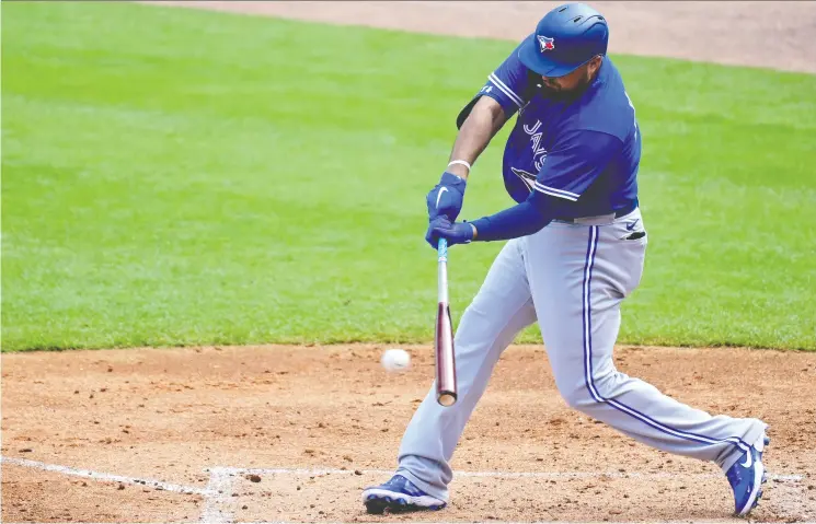  ?? DOUGLAS P. DEFELICE / GETTY IMAGES ?? Rowdy Tellez of the Blue Jays hits a single Sunday in a spring training game against the Yankees in Tampa, Fla.