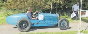  ??  ?? Among the cars that had appeared at Syston Park in period was this stunning 1925 Bugatti with twin rear wheels, driven by T Lee, seen here being flagged away for its afternoon run.