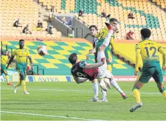  ?? REUTERS ?? Burnley’s Chris Wood scores their first goal against Norwich.