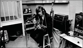  ?? (Special to the Democrat-Gazette/HBO) ?? Robin Gibb, of Bee Gees fame, plays his 12-string in 1969 during his brief solo career.