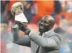  ?? Associated Press file ?? Davis carries the Lombardi Trophy onto the field before the Broncos played the Panthers in Denver in 2016.