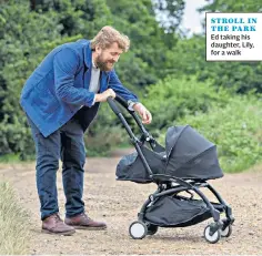  ??  ?? STROLL IN THE PARK Ed taking his daughter, Lily, for a walk