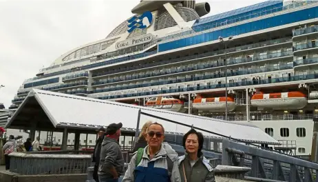  ?? — Photos: LIONG KAM CHONG ?? The writer and his wife posed for a photo before boarding the cruise ship.