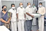  ??  ?? Party treasurer P Vettrivel hands over enrolment forms to Central Chennai secretary Santhana Krishnan