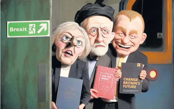  ??  ?? > Three actors, portraying Theresa May, Jeremy Corbyn and Tim Farron, at a new general election-themed attraction called ‘Poll-tergeist’, which is an addition to Derren Brown’s Ghost Train: Rise of the Demon attraction at Thorpe Park Resort, Surrey,...