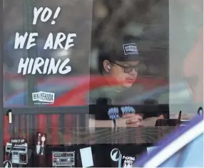  ?? NAM Y. HUH/AP FILE ?? Robust hiring shows that businesses still want to add workers to meet demand – a trend that should ease fears of an economic downturn.