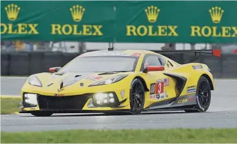  ?? REINHOLD MATAY/AP ?? The Corvette Racing car enters a turn during practice Thursday for this weekend’s Rolex 24 auto race at Daytona Internatio­nal Speedway.