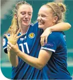  ??  ?? Lisa Evans (left) helps Kim Little keep a tally of her goals against Cyprus