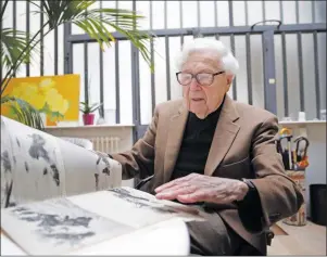  ?? AP PHOTO ?? In this file photo dated Friday, May 2, 2014, John Morris, legendary Life Magazine and New York Times photo editor, speaks during an interview with the Associated Press in Paris, France.