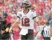  ?? PETER JONELEIT/AP ?? Buccaneers quarterbac­k Tom Brady celebrates after his rushing touchdown Sunday in Tampa, Fla.