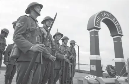  ?? PHOTOS BY DARREN CALABRESE, THE CANADIAN PRESS ?? Reenactors from the 25th Nova Scotia Rifles attend the unveiling of ‘The Last Steps’ memorial art installati­on in Halifax on Friday.