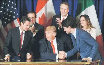  ??  ?? (Front, from left) Mexican President Enrique Pena Nieto, Trump and Canadian Prime Minister Justin Trudeau are pictured after signing a new free trade agreement in Buenos Aires on the sidelines of the G20 Leaders’ Summit. — AFP photo