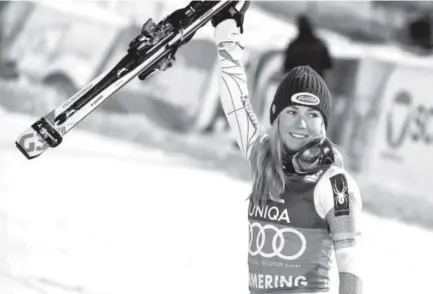  ??  ?? American Mikaela Shiffrin celebrates after securing victory in a World Cup night slalom on Thursday.