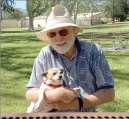  ?? Courtesy photo ?? Barry Beggs sits on a bench at a park with his dog, Ruby. Ruby died due to injuries caused by an attacking pit bull on Dec. 10. Beggs was also attacked by the dog.