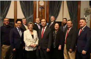  ?? JULIA MALAKIE — LOWELL SUN ?? Lowell City Council members, from left, Corey Robinson, Paul Ratha Yem, John Leahy, Rita Mercier, Dan Rourke, Mayor Sokhary Chau, Wayne Jenness, Kim Scott, John Drinkwater, Vesna Nuon, and Vice Chair Erik Gitschier.