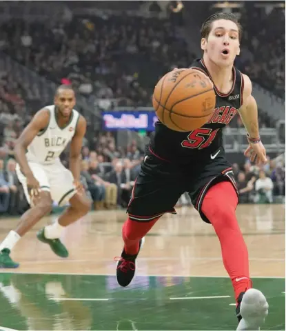  ?? MORRY GASH/AP ?? Point guard Ryan Arcidiacon­o, who had 22 points, grabs a loose ball during the first half Wednesday against the Bucks.