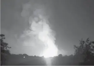  ?? REUTERS PHOTO ?? Flames light up the sky after an Enbridge gas pipeline explosion in rural Moreland, Ky., in this still image taken from social media video.