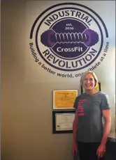  ?? Photo by Ernest A. Brown ?? Industrial Crossfit Revolution owner Kelly Carse gets ready to take part in a workout at her gym, located at 154 Smithfield Ave., in Pawtucket. Crossfit is a type of exercise regimen that has grown explosivel­y in popularity over recent years. It relies...