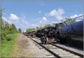  ?? STEVE LITSCHAUER — MANATEE COUNTY GOVERNMENT VIA AP ?? A derailed freight train operated by Seminole Gulf Railway near Bradenton, Fla., on Tuesday.