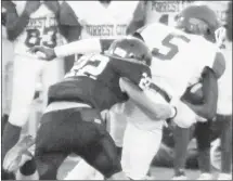  ?? Submitted Photo ?? A Forrest City Junior Mustang running back is taken down in front of the Forrest City sidelines by Stuttgart defenders. The Junior Mustangs will host Nettleton Thursday at Mustang Stadium.