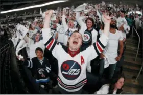  ?? JOHN WOODS — THE CANADIAN PRESS VIA AP ?? In this file photo Winnipeg Jets fans react during a viewing party in Winnipeg, Manitoba, for Game 7 of an NHL hockey second-round playoff series between the Jets and the Nashville Predators being played in Nashville, Tenn. Winnipeg was already gripped...