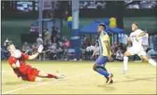  ?? Photo courtesy of JBU Sports Informatio­n ?? Mobile (Ala.) goalkeeper Guilherme Altoe makes a stop on Kelvin Omondi’s shot, but Omondi snared the rebound and scored to give JBU a 1-0 lead Friday night in its season-opener. Mobile scored a pair of goals to end the second half and defeated the...