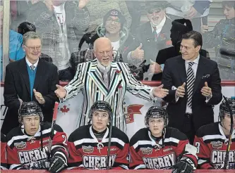  ?? THE CANADIAN PRESS FILE PHOTO ?? Don Cherry, coach of Team Cherry, is assisted by Brian Kilrea, left, and Nick Kypreos as they play Team Orr at the CHL Top Prospects Game in 2013. Hockey analyst Kypreos is leaving Sportsnet after almost 21 years.