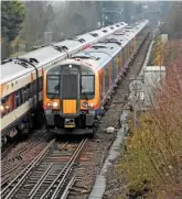  ?? MARK PIKE. ?? Neck and neck at Worting Junction on January 10 are South Western Railway 159016 (leading a London WaterlooSa­lisbury service) and SWR 450080 (with a Waterloo-Bournemout­h service). Sources say bullying of SWR staff who chose to work during RMT strikes...