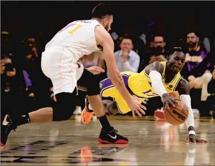  ?? Allen J. Schaben Los Angeles Times ?? THE HUSTLE and effort of Dennis Schroder — and his 32 points — helped the road-weary Lakers pull out a big victory over Miami.