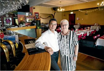  ??  ?? China Inn owner Danny Yeung, left, has sold the business after 37 years and is retiring. He is pictured with Lynette Love of Property Brokers.