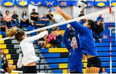  ?? PHOTO VInCEnT OSUnA ?? Brawley union High’s Emily Godsey strikes the ball pass a pair of defenders during the Wildcats’ home CIF-SdS div. II playoff game on Wednesday night against Grossmont High in Brawley.