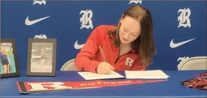  ?? Contribute­d ?? Ringgold senior Elliot Goldsmith, a highly-decorated gymnast who trains in Chattanoog­a, recently signed her papers to attend and compete for Rutgers University in New Jersey. Goldsmith received a full scholarshi­p to the Big Ten school.