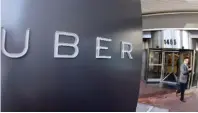  ??  ?? SAN FRANCISCO: A man leaves the headquarte­rs of Uber in San Francisco. Judges for the Pennsylvan­ia agency that regulates buses and taxis recommende­d on Tuesday, Nov 17, 2015, a record $50 million fine against ride-sharing company Uber for operating in...