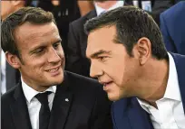  ?? ARIS MESSINIS / POOL VIA ASSOCIATED PRESS ?? French President Emmanuel Macron (left) and Greek Prime Minister Alexis Tsipras arrive at Pnyx hill in Athens on Thursday. Macron called on members of the European Union to reboot the 60-year-old bloc with sweeping political reforms.